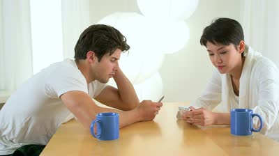 Courtesy of Google Image search: Couple checking out their smart phones.
