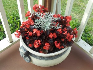 "Corner of porch with flowers on Cedar Creek Lake in East Texas" Have a great day copyright 2014 John J. Rigo